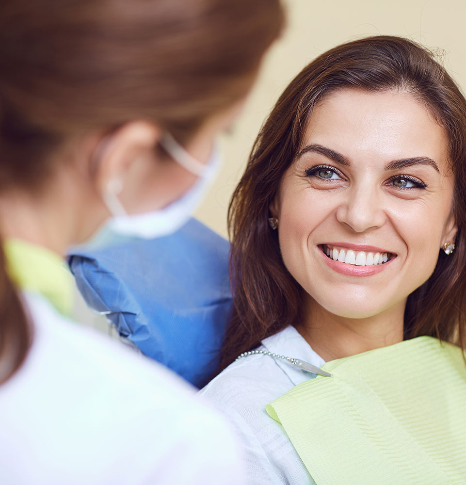 patient smiling brightly while getting ready for their dental treatment