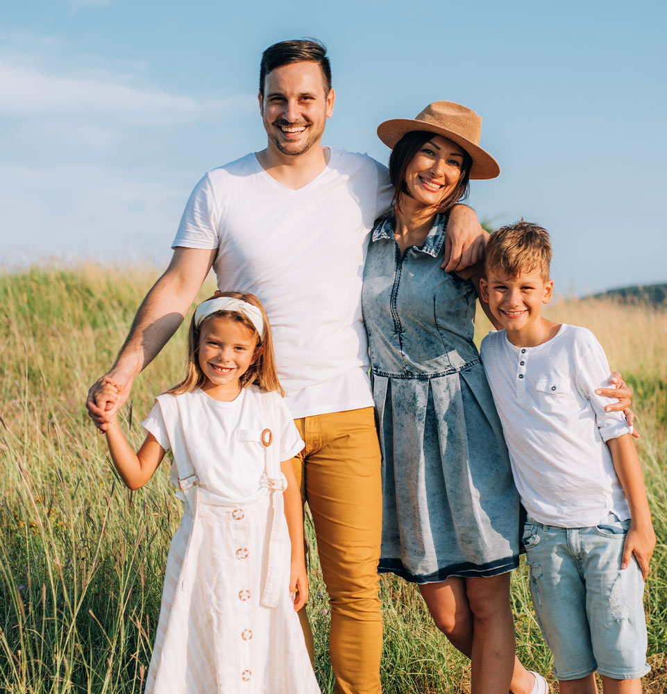 group photo of a family in a open valley