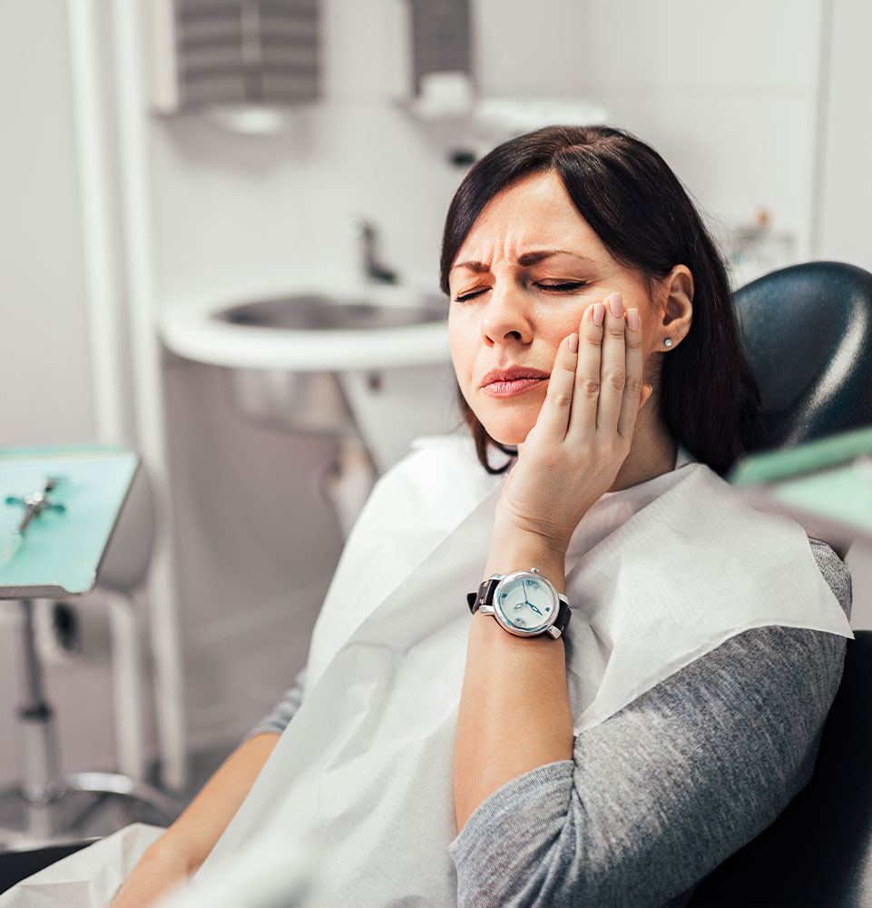 person dealing with mouth pain