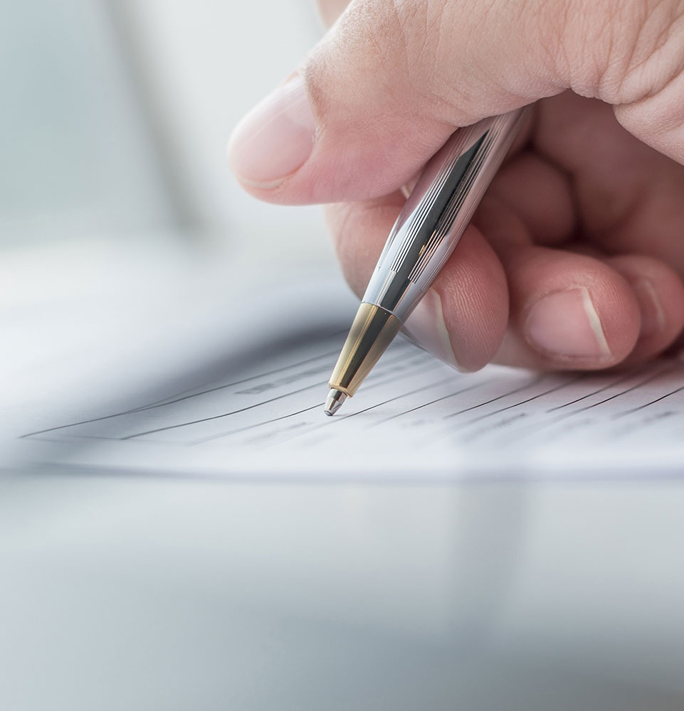 close up of writing on forms and agreements