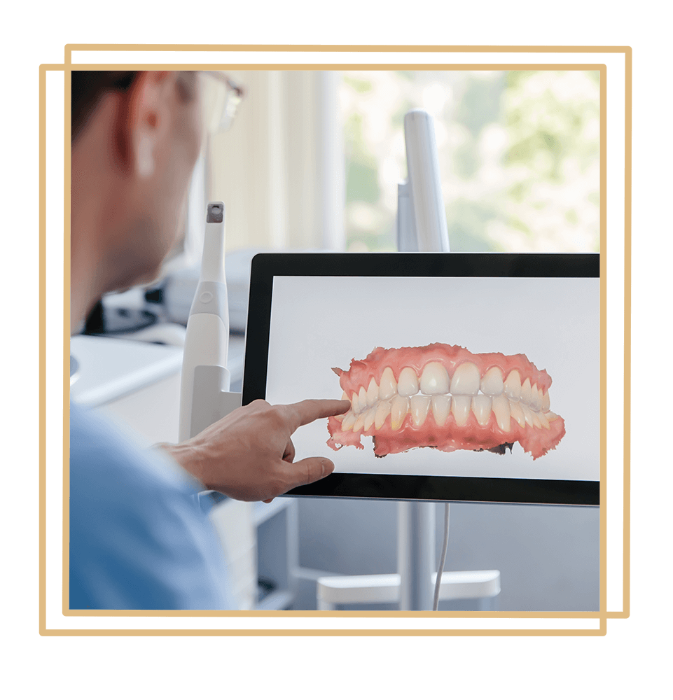 Dentist examining dental scan of a patient on the computer screen