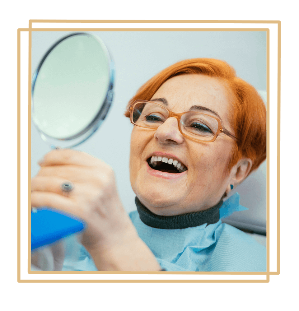 patient smiling brightly after their dentures procedure