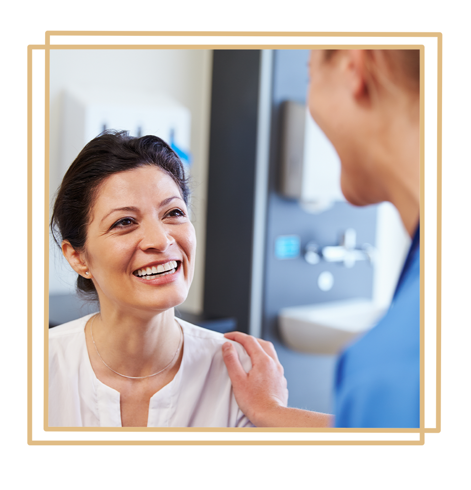 patient going over dental procedure infirmation with staff member