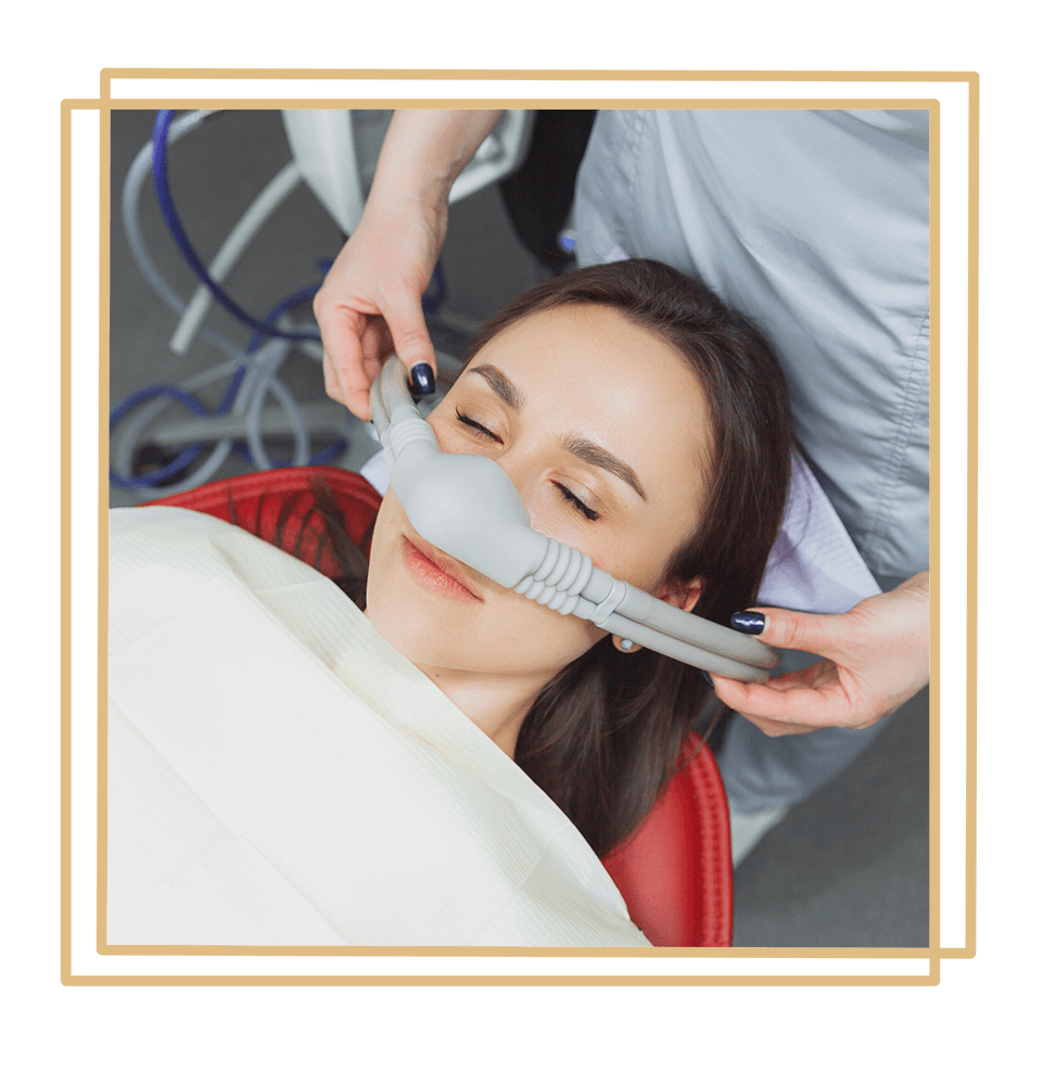 dentist puts inhalation sedative mask on his patient.