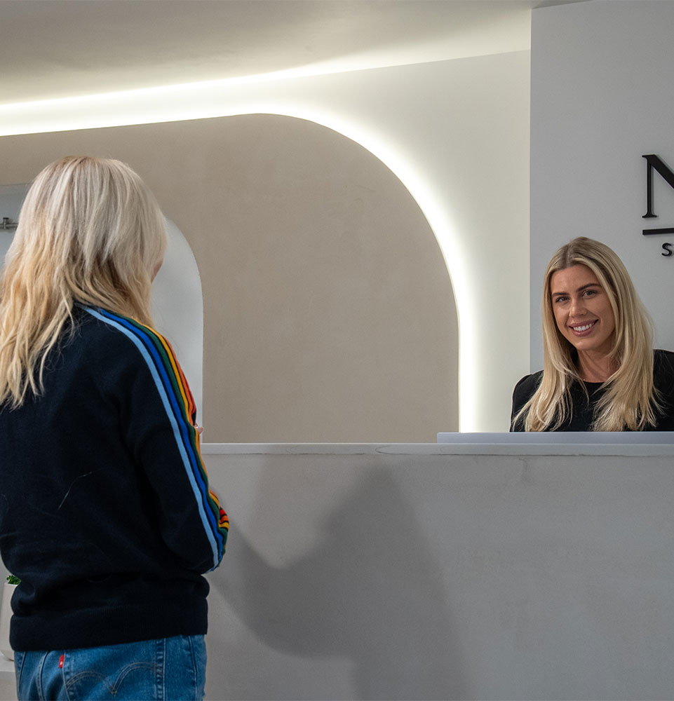 team member checking Patient into dental office