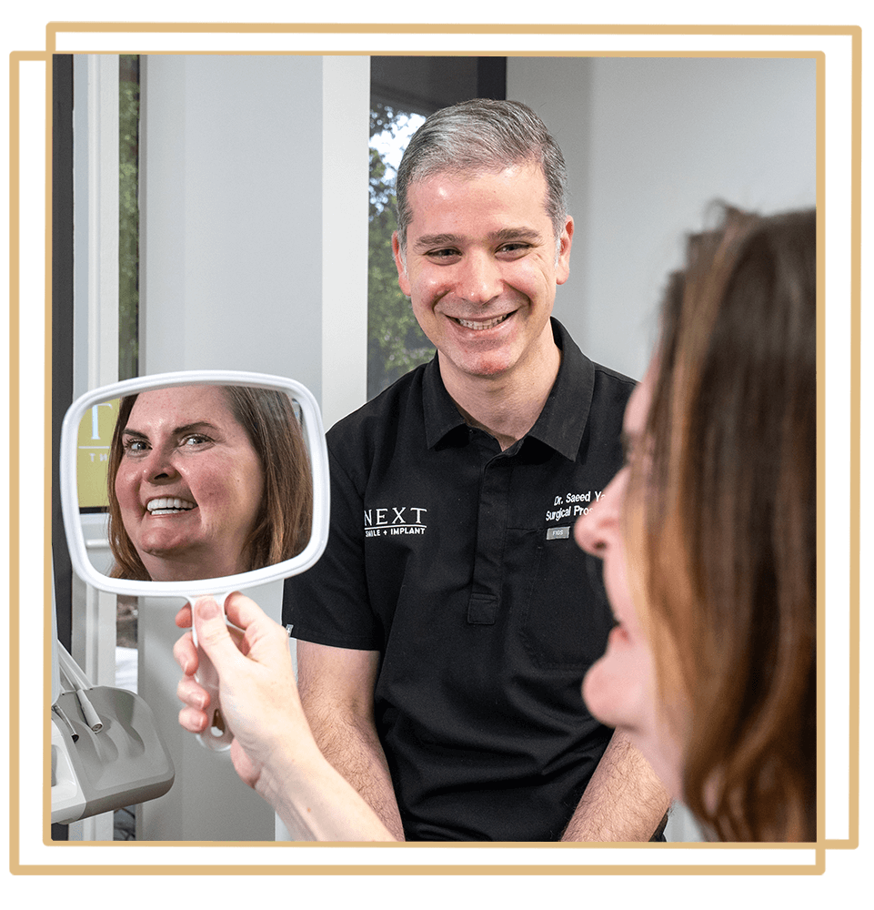 Patient Smiling into a mirror