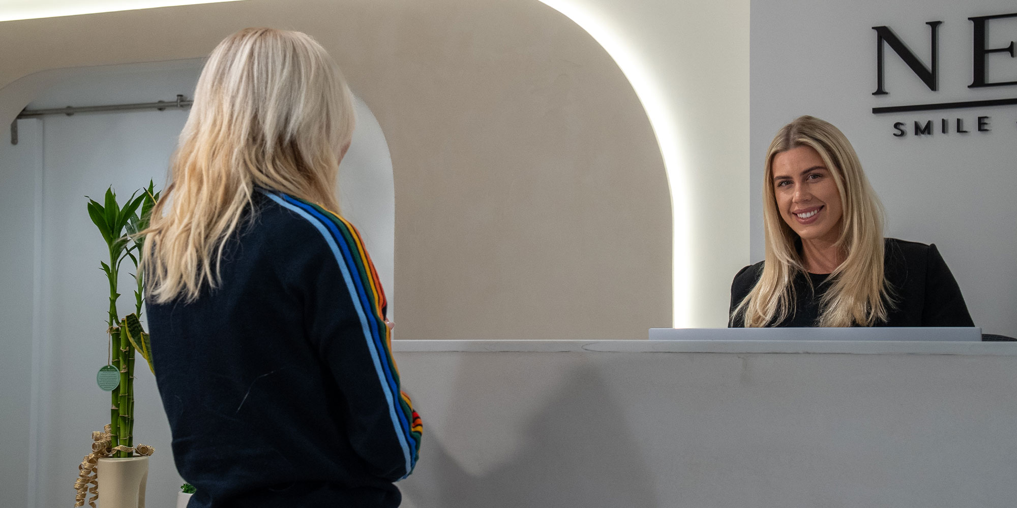 team member checking Patient into dental office