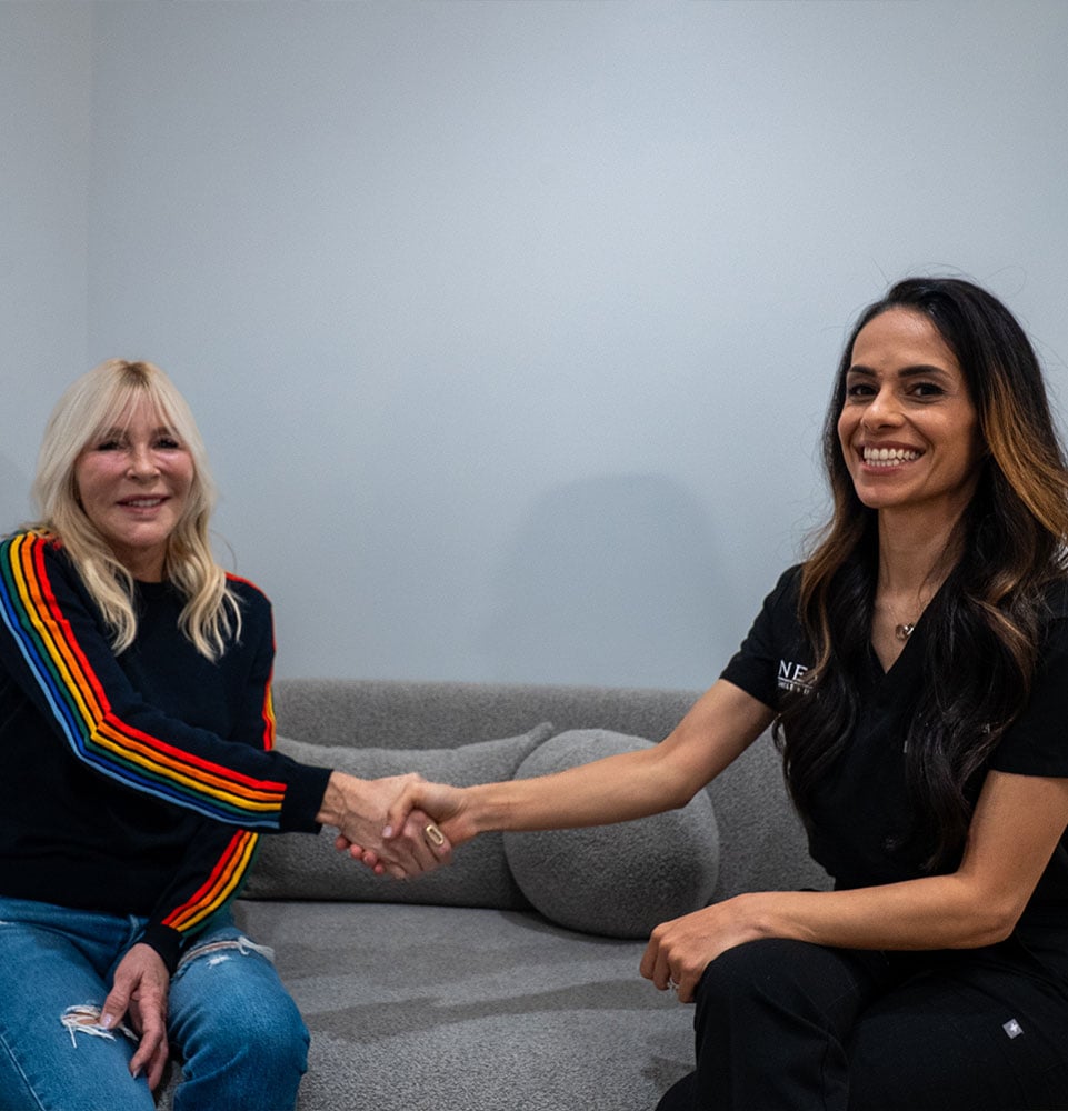 Team member and Patient shaking hands